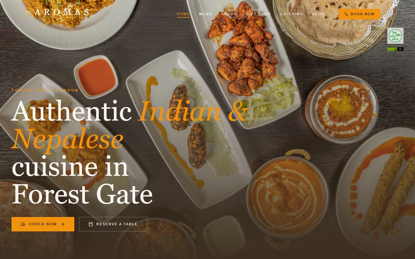 Aromas: the restaurant homepage hero with dishes laid out on a table